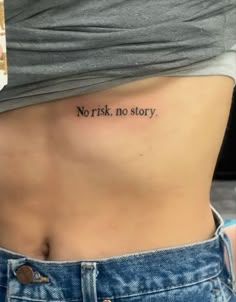 a woman's stomach with the words norisk no story tattooed on her side