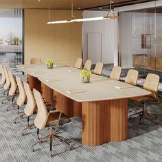 a large conference table with chairs and vases on it in front of a window