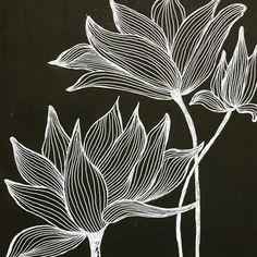 a black and white drawing of two flowers