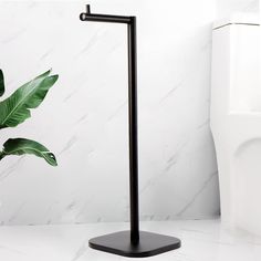 a bathroom with a plant on the counter