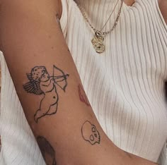 a woman with a tattoo on her arm