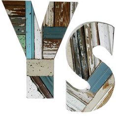 the letters y and v are made out of old wooden planks with paint chipping on them