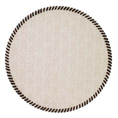 a round rug with black and white lines on it's side, in the shape of a circle