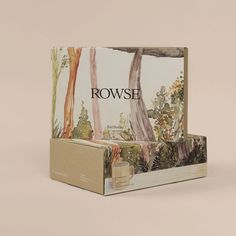 the box is made out of cardboard and has an image of trees on it