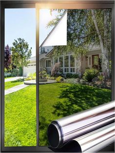 an open window showing a house and yard