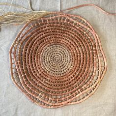 a woven basket sitting on top of a table