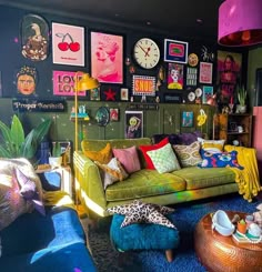 a living room filled with lots of colorful furniture and pictures on the wall above it