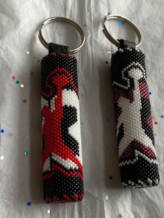 Specialty designer hand beaded Jordan keychains, Michael Jordan jump keychains, SOLD SEPARATELY. Check with seller before purchasing to see what is available. Jordan Keychains, Michael Jordan Jump, Jordan Flag, Jordan Iv, Petra Jordan, Cross Gift, Beaded Jewlery, Beaded Cross, College Gifts