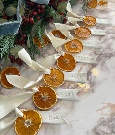 orange slices are arranged on the table with ribbons