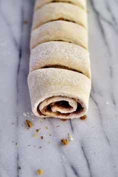 a rolled up food item sitting on top of a table