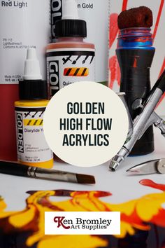 the golden high flow acrylic is on display with other paints and tools around it