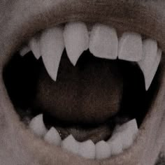 an open mouth with toothy white teeth