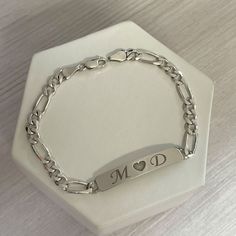 Personalized nameplate bracelet in sterling silver. We can engrave names, initials or any words that you would like on top of or even inside the bracelet. These bar bracelets are very cute and durable. The chain style is Figaro chain Surprise your loved ones with a great gift for his birthday, Christmas, Father's Day, or any other occasion. It takes 14 to 21 business days ♥ The most unique jewelry you can find, perfect gift for you and your loved one. ♥ All our jewelry is custom made by hand wit Luxury Initials Bracelet For Anniversary, Personalized Sterling Silver Name Bracelet, Sterling Silver Name Bracelet Jewelry, Classic Personalized Charm Bracelet For Anniversary, Sterling Silver Initials Bracelet For Personalized Gift, Personalized Sterling Silver Initials Bracelet, Sterling Silver Custom Name Bracelet For Anniversary, Anniversary Sterling Silver Bracelet With Custom Name, Custom Name Sterling Silver Bracelet For Anniversary