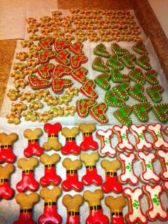 many decorated cookies are displayed on a table