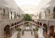 an artist's rendering of the inside of a building with tables, benches and trees