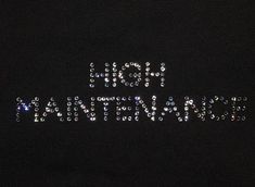 a black shirt with the words hot mama written in sparkling sequins on it