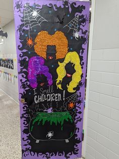 a door decorated with halloween decorations and writing