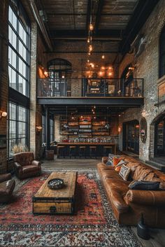 a living room filled with furniture and lots of windows