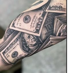 a man's arm with money on it