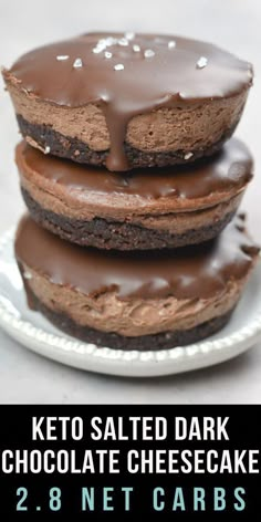 keto salted dark chocolate cheesecakes stacked on top of each other