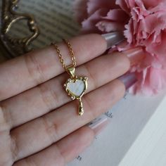 Magic Mirror Necklace, Heart Mirror Jewelry, Fairytale Necklace, Coquette Aesthetic, Gift for Her, Magical Jewelry, Cute Girly Necklace ☽ 14K Gold Plated, Cubic Zirconia, Shell Pendant (25.7x12.5mm) ☽ This is a gold plated charm meaning that it requires extra care to keep its shine and color intact. Please follow these tips to make the charm last longer in its original condition: avoid wearing it to the beach, pool, shower, bathtub, hot tub; avoid it touching any lotions, creams, or sweat; take Fairycore Clavicle Chain Jewelry As Gift, Fairycore Clavicle Chain Necklace As Gift, Fairycore Clavicle Necklace As A Gift, Fairycore Style Clavicle Chain Jewelry As A Gift, Fairycore Jewelry As A Gift, Fairycore Heart-shaped Jewelry Gift, Fairycore Heart-shaped Gift Jewelry, Fairycore White Necklace For Gift, Dainty Heart Necklace With Clavicle Chain For Jewelry Making