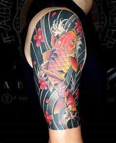 a man with a tattoo on his arm has a koi fish and flowers on it