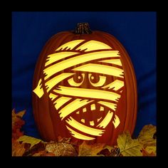 a carved pumpkin with an evil face on it