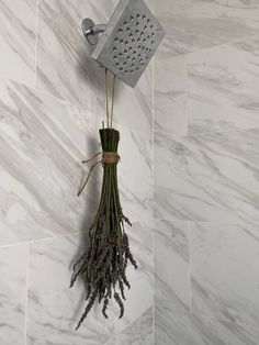 a shower head with flowers attached to it