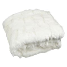 a white fur blanket folded on top of each other