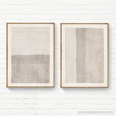 two framed art pieces on a white brick wall, each with different lines and shapes