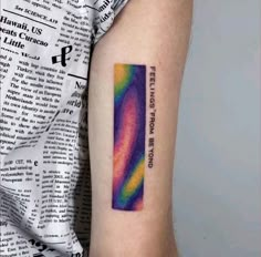 a person with a tattoo on their arm has a rainbow colored bar that says, let's not afraid to see it