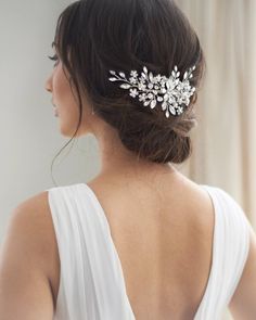 a woman wearing a bridal hair comb