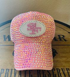 49ers Blingy Sports Hat You will sparkle, bling and shine with this custom 49ers Sports Hat.  Cheer on your favorite team and do it with style. Pink blinged out San Francisco 49ers adjustable snap back hat.  Please note hat is made to order. Processing time is 1 to 2 weeks. 49er Crochet Hat, Sports Hat, Snap Back Hat, Sport Hat, Style Pink, Snap Back, Snap Backs, San Francisco 49ers, Trucker Cap