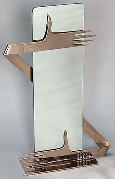 a silver fork and knife holder on a table