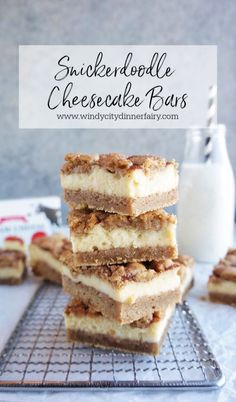 a stack of cheesecake bars sitting on top of a cooling rack