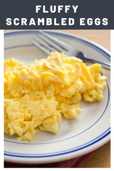 scrambled eggs on a white and blue plate with text overlay that reads fluffy scrambled eggs