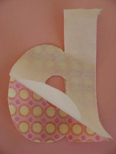 the letter b is made up of paper and fabric