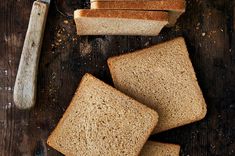 slices of whole wheat bread next to a knife