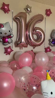 hello kitty balloons and heliums are on the wall