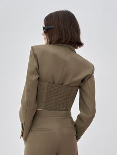 MO&Co. Women's Two Piece Cropped Blazer Features : - Short suit cut - Vintage peak lapelsCode : MBB3BLA004Length of size M is 42.5cmBrown : Model is 179cm tall and wearing a size M MATERIALS & CARE : Material : 64.5% Wool 35.5% PolyesterDo not wash, do not bleach Hang to dry, do not tumble dry Iron at low temperature, professional dry cleaning Do not expose to the sunPlease select your own size in the size chart according to your figure and serve model size as a guideline. Fitted Cropped Blazer With Pockets, Fitted Khaki Suit For Work, Fitted Chic Khaki Blazer, Fitted Khaki Blazer With Notch Lapel, Fitted Cropped Outerwear For Semi-formal Occasions, Fitted Khaki Blazer For Work, Fitted Structured Suit With Pockets, Cropped Blazer, Short Suit