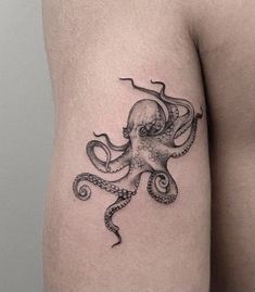 an octopus tattoo on the left thigh