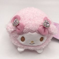 a hello kitty doll with pink hair and bows