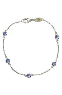 Bezel set blue sapphire stations add a vintage sparkle to this slim line necklace set in gold-tone sterling silver to complete a dainty look. 7" length Lobster clasp Sterling silver, blue sapphires Imported Vintage Blue Necklace, Delicate Blue Sterling Silver Necklace, Light Blue Sapphire Necklace, Silver Sapphire Necklace With Polished Finish, Luxury Sapphire Sterling Silver Necklace, Blue Sterling Silver Multi-stone Necklace, Levian Jewelry, Light Blue Sapphire, Station Necklace