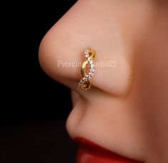 a close up view of a nose with a ring on it