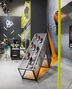 the inside of a shoe store with shoes on display