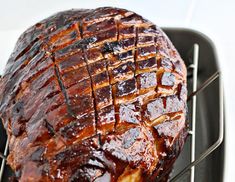 a large piece of meat sitting on top of a grill