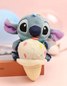 a stuffed animal is eating an ice cream cone