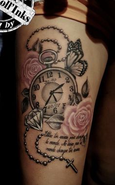 a woman's thigh with a clock and roses on it