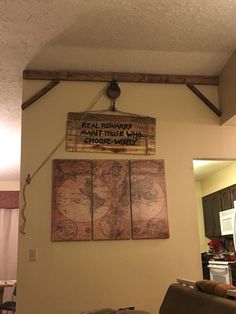 a map hanging on the wall in a living room