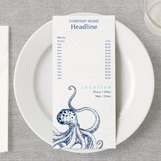 a table setting with an octopus place card